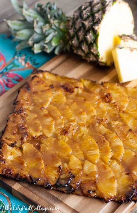 A pineapple tart sitting on a cutting board 