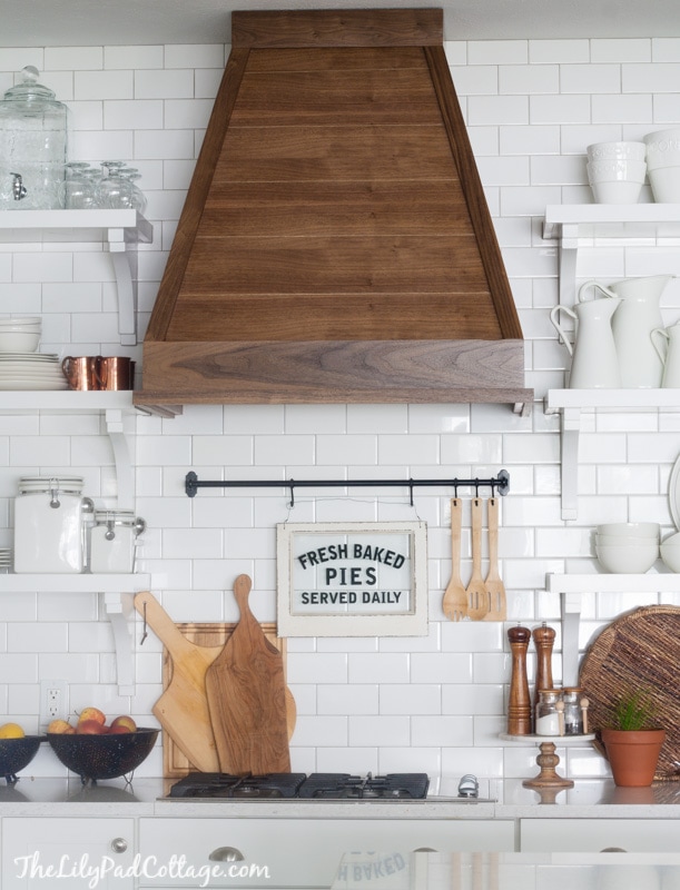Wood kitchen hood with subway tile