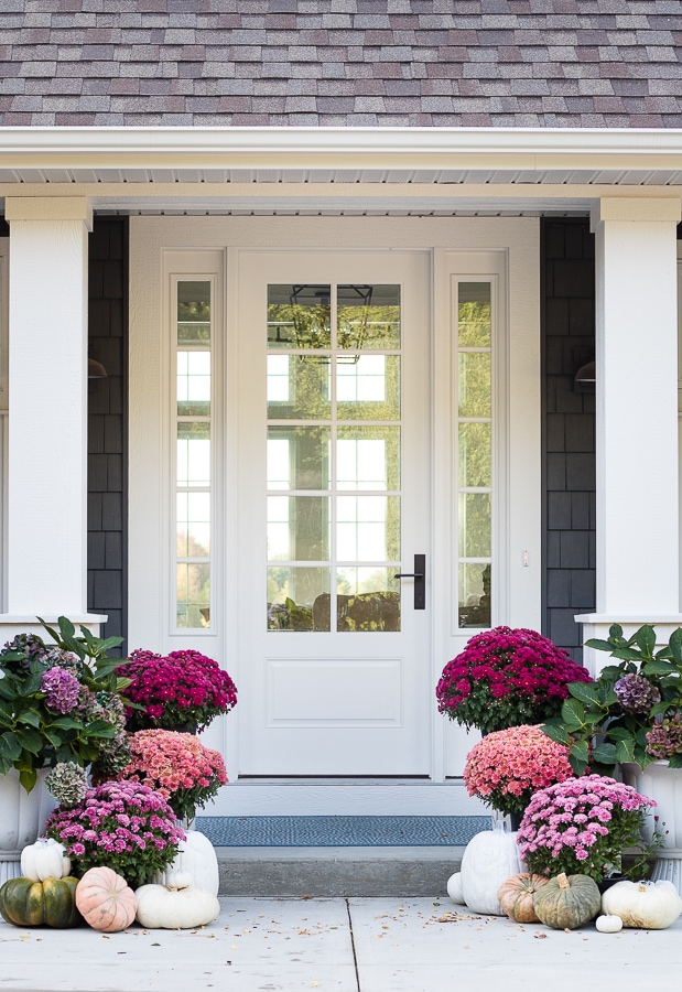 A fall front porch with mums