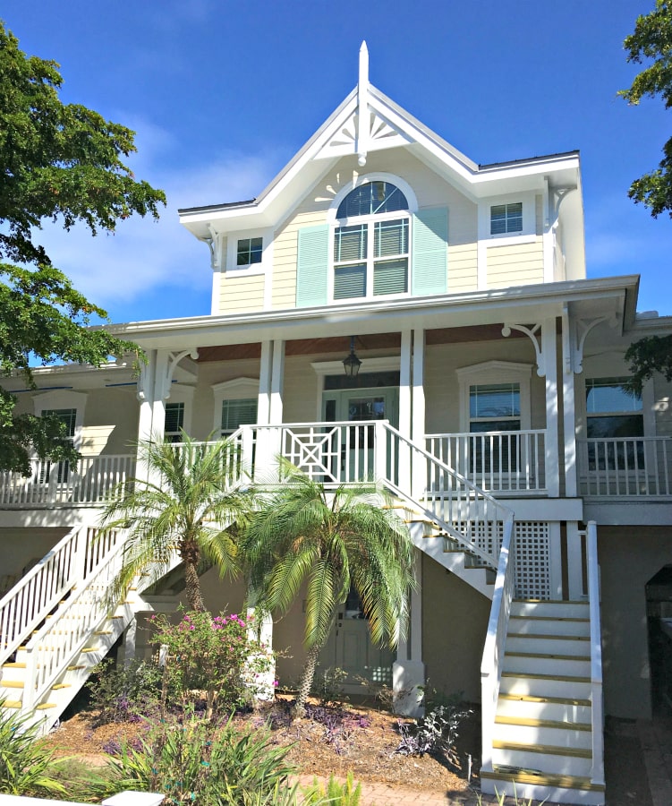 Beach house with palm trees and deck