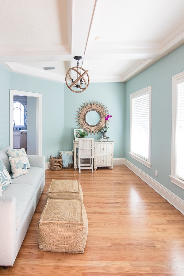 A living room with a wooden floor