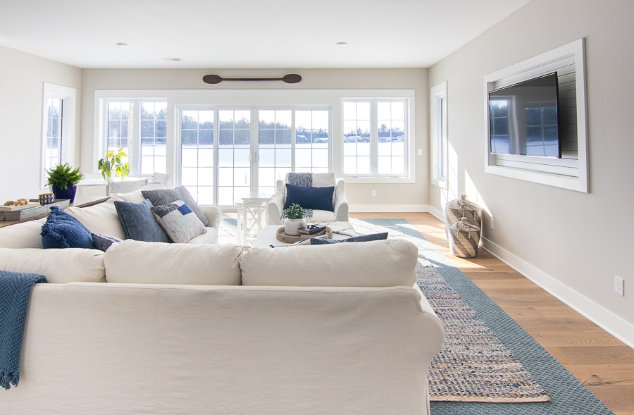 A living room filled with furniture and a large window