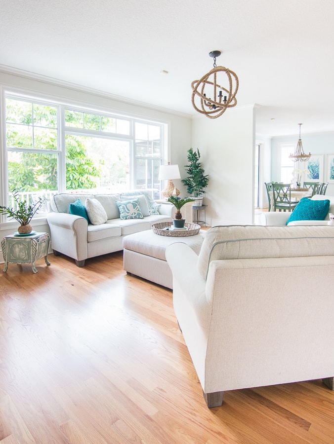 A living room filled with furniture and a large window