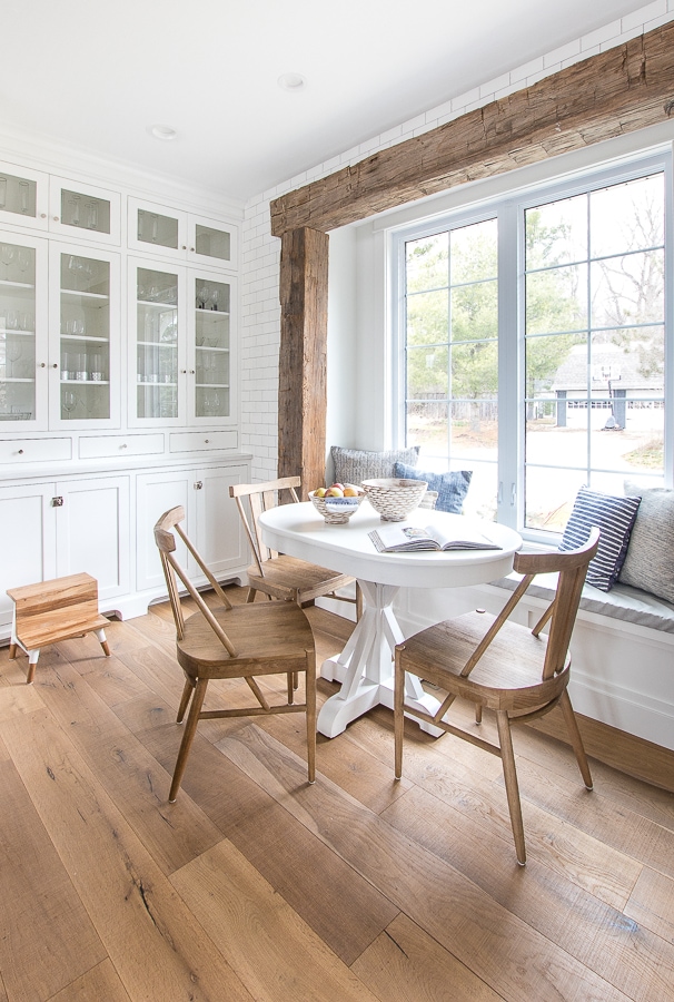 A breakfast nook filled with furniture and a large window