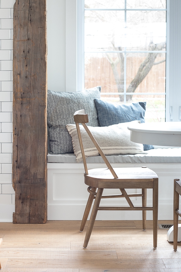 A breakfast room filled with furniture and a large window