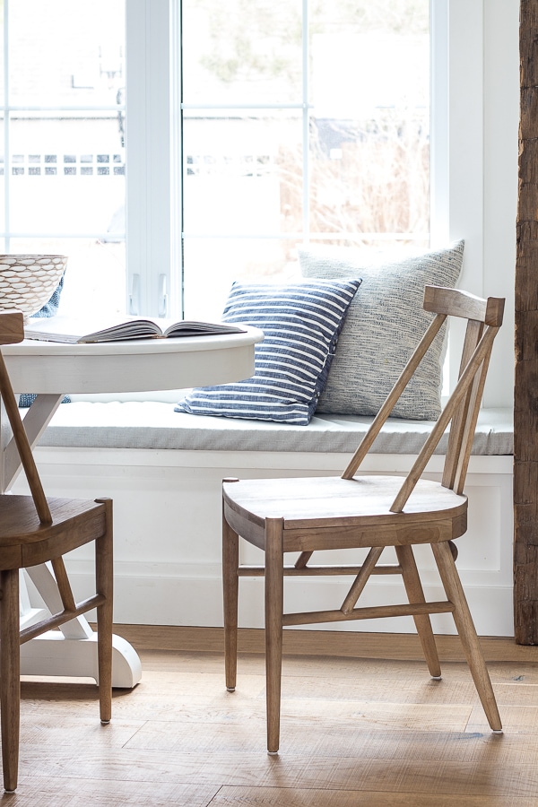 A dining room table in front of a window