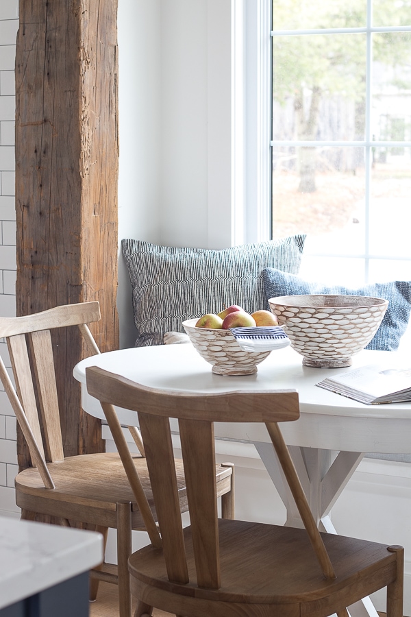 A dining room table in front of a window