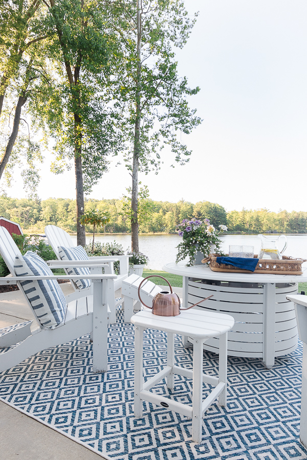 white adirondack chairs and white fire pit table