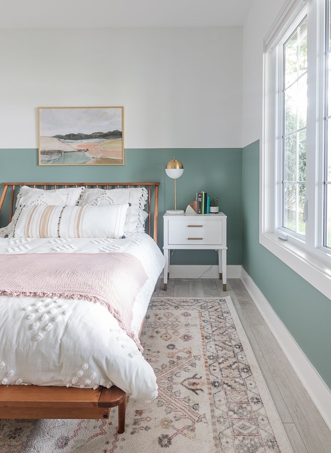 A bedroom with a large bed sitting in a room