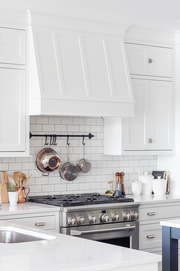 white kitchen cabinets with white subway tile