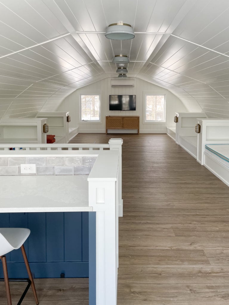 white planked walls and luxury vinyl plank flooring bunk house