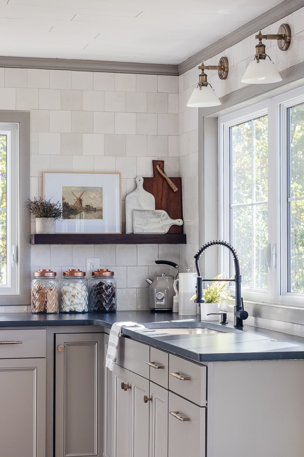 gray cabinets, soapstone counters, white square tile, walnut open shelving