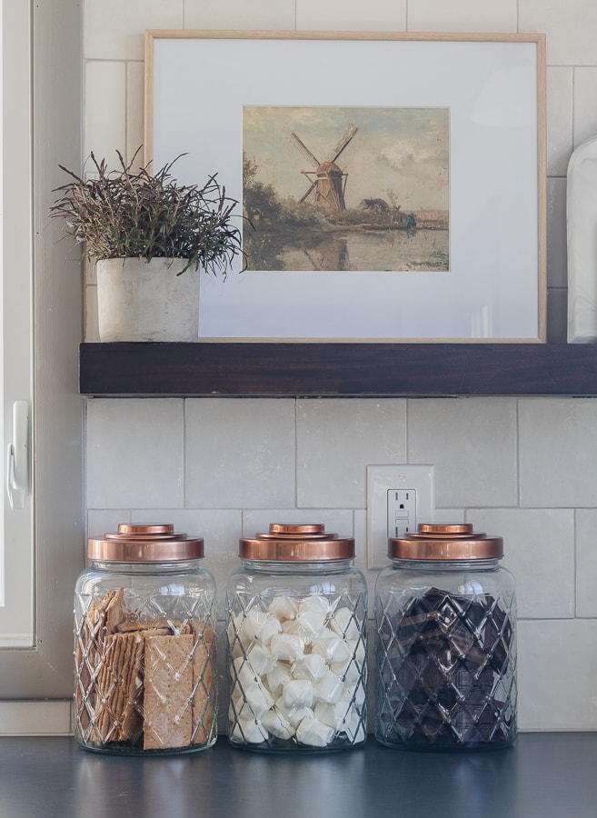copper kitchen canisters, white tile backsplash, soapstone counters 