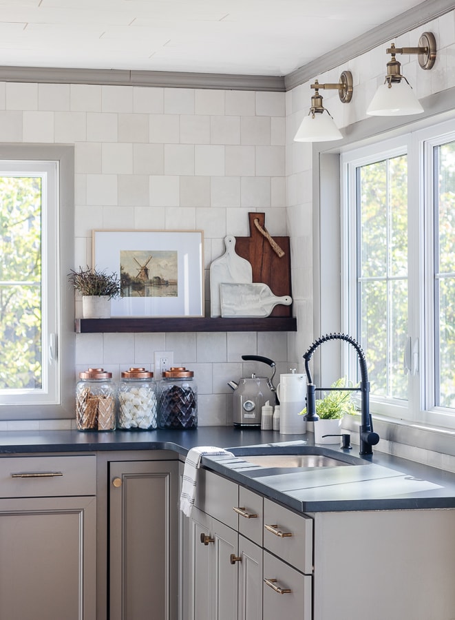 Cottage Kitchen Renovation Gray and White Kitchen with soapstone counters and brass sconces and hardware