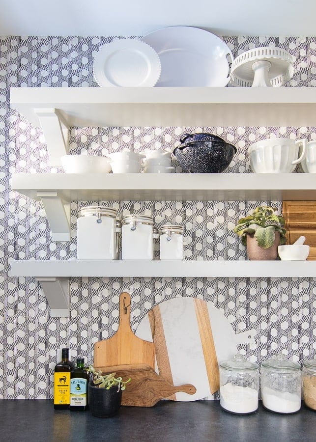 A pantry with wallpaper