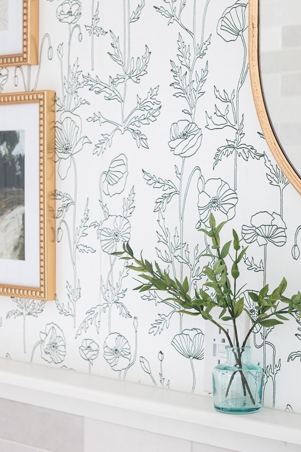 Floral wallpaper with brass photo frame