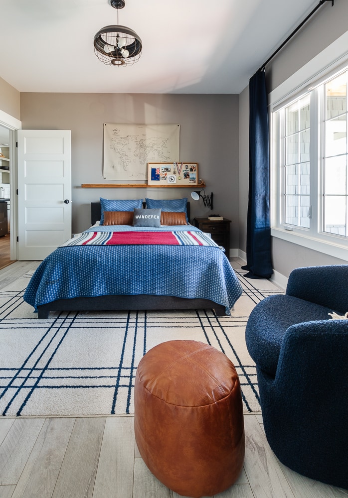 bedroom with gray walls and navy bedding