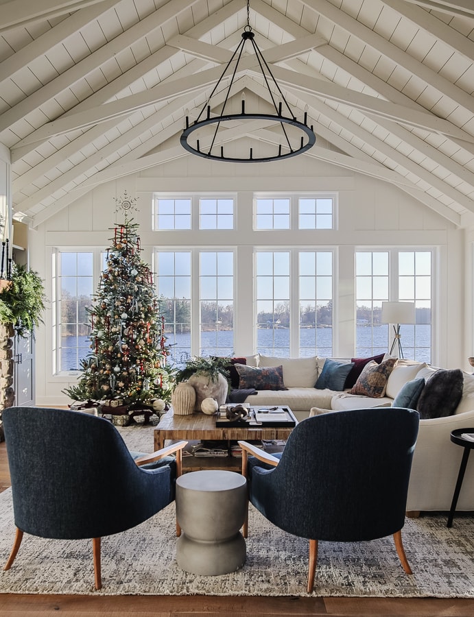living room with lakeview decorated for christmas