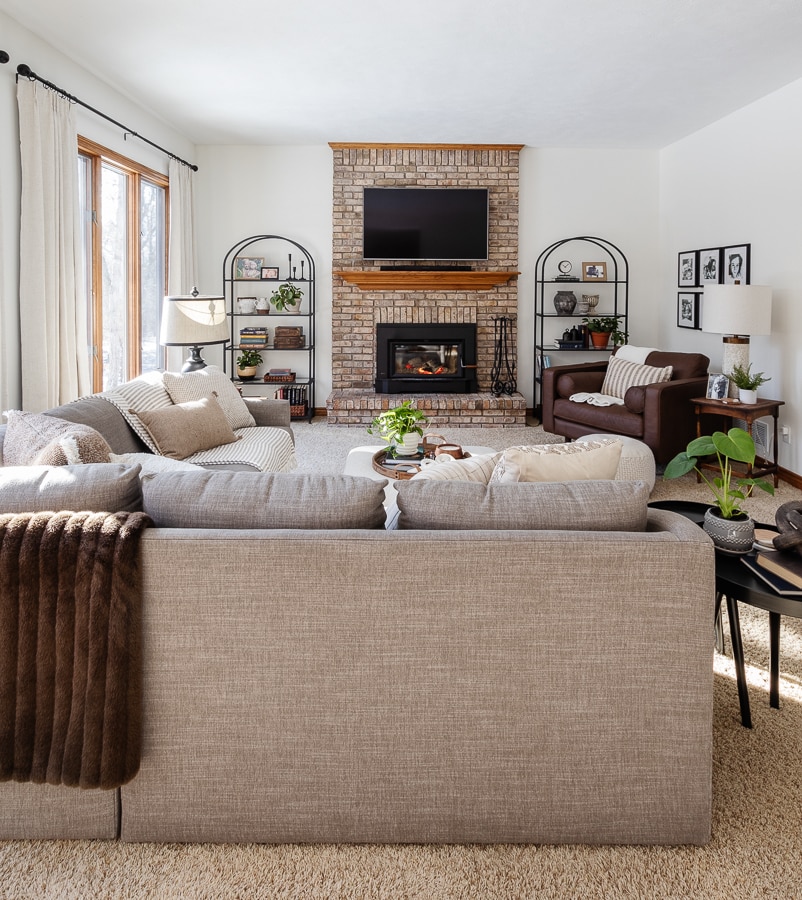 neutral living room with gray sofa and white walls