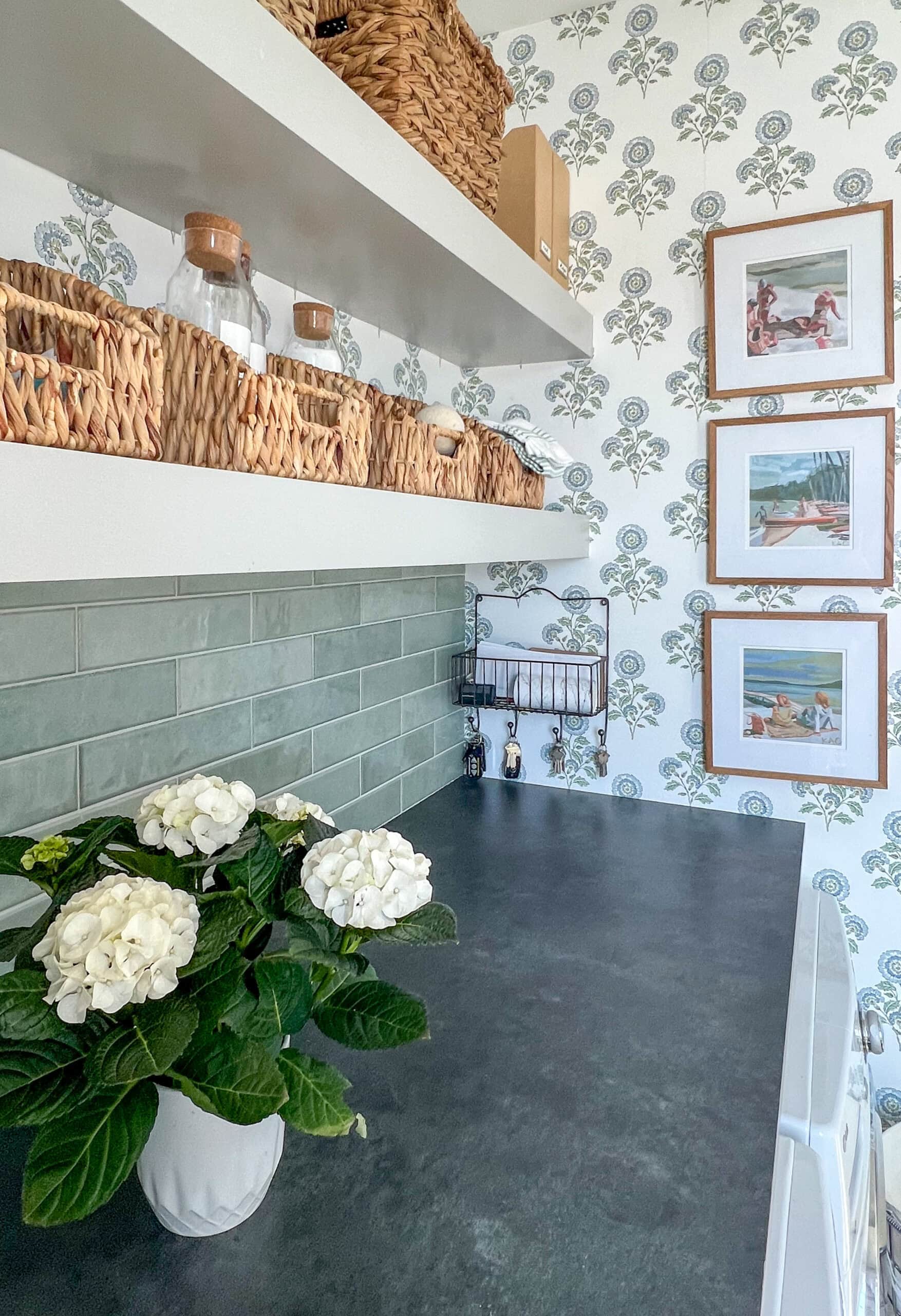laundry room counter with floral wallpaper