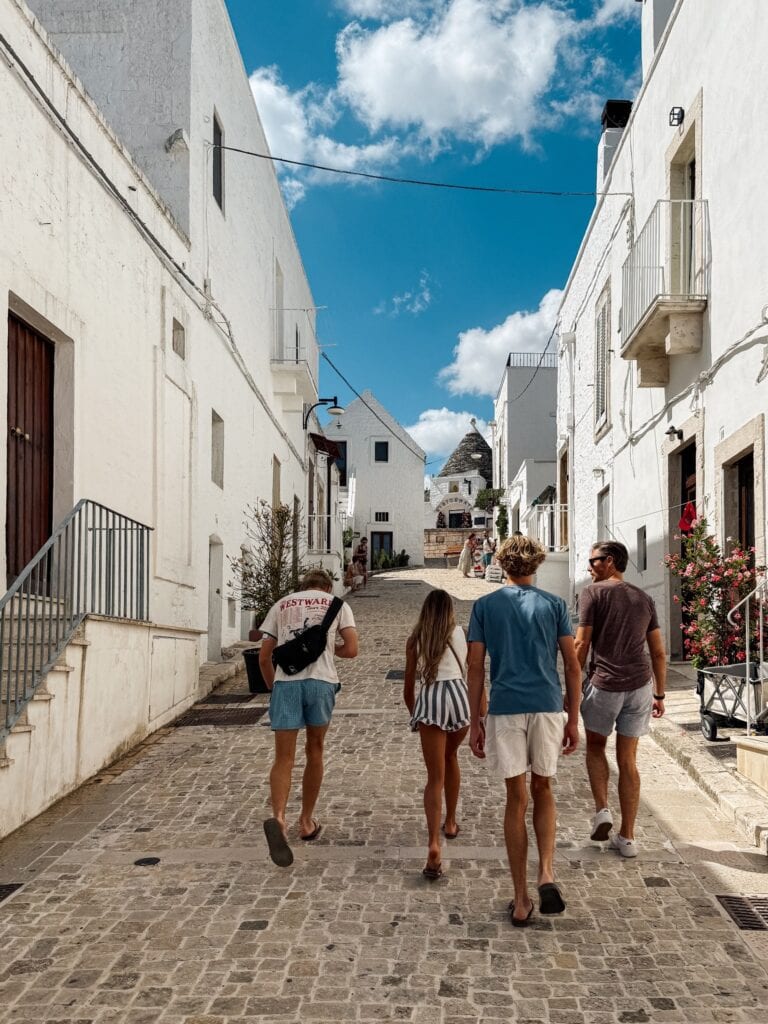 family exploring italian village